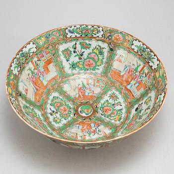 A famille rose 'Canton' punch bowl, Qing dynasty, late 19th century.