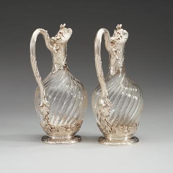 A pair of French late 19th century silver and glass wine-flagons.