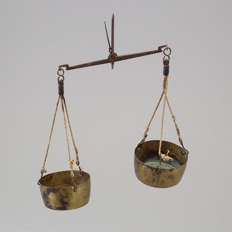 A 19th/20th century brass scale.