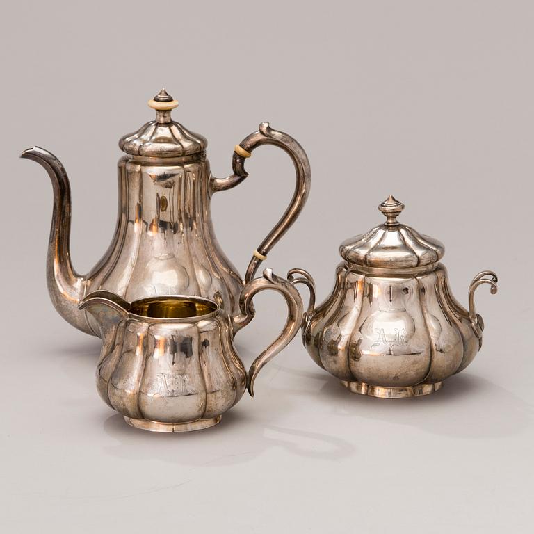 A 3-piece Russian silver coffee set, marks of Sazikov, St Petersburg 1869-70.