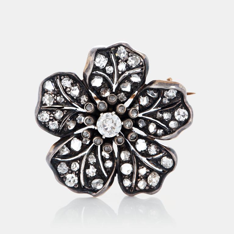 A flower brooch set with old-, eight- and rose-cut diamonds.