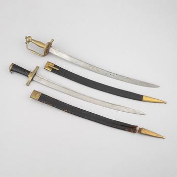 Two cutlasses, Swedish, m/1856 and m/1748-1856, with sheath.