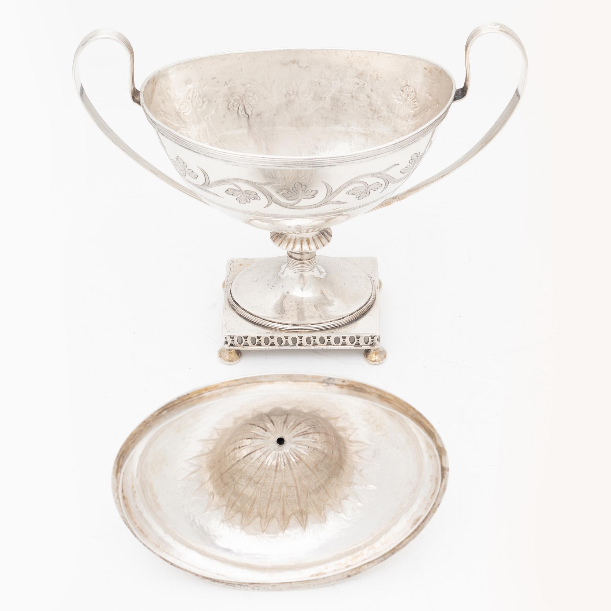 A silver sugarbowl with lid and a creamer, marks of Olof Hellbom, Stockholm, Sweden 1799-1800.