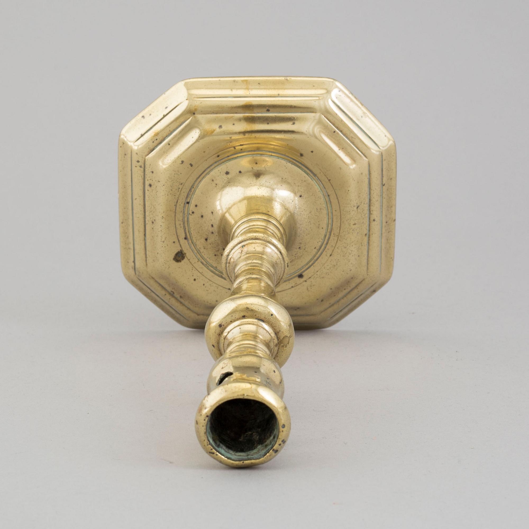 An 18th century bronze candlestick.
