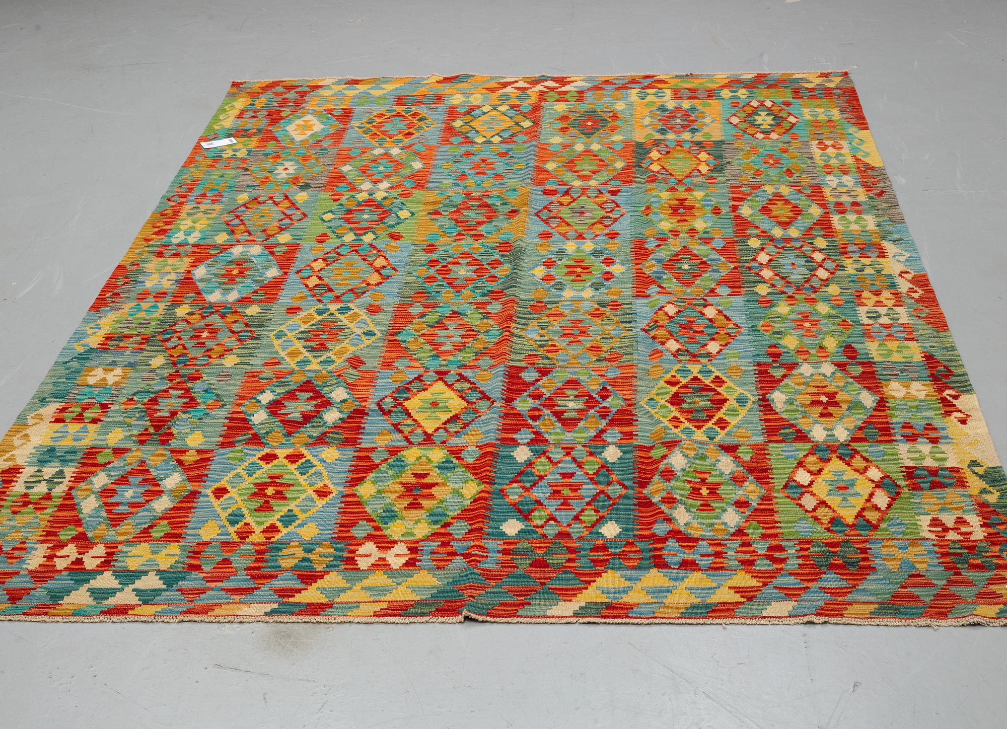 A carpet, kilim 295 x 205 cm.