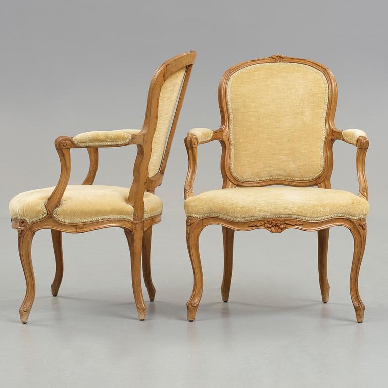 Two matched Louis XV 18th century armchairs.