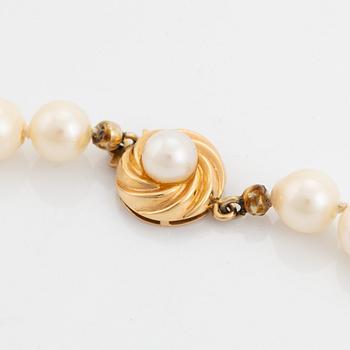 Cultured pearl necklace, with heart shaped charm.