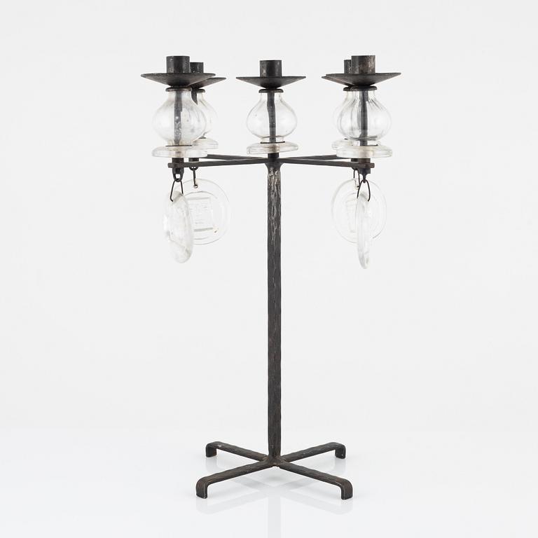 Erik Höglund, a iron and glass candelabra.