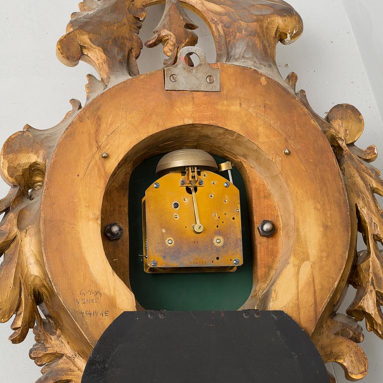 A rococo style wall clock, first half of the 20th century.