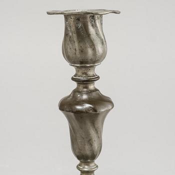 A pair of Rococo candlesticks in pewter, made by Eric Pettersson Krietz in Stockholm 1763.