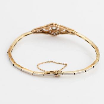 A 14K gold and platinum bracelet set with old- and rose-cut diamonds and pearls.