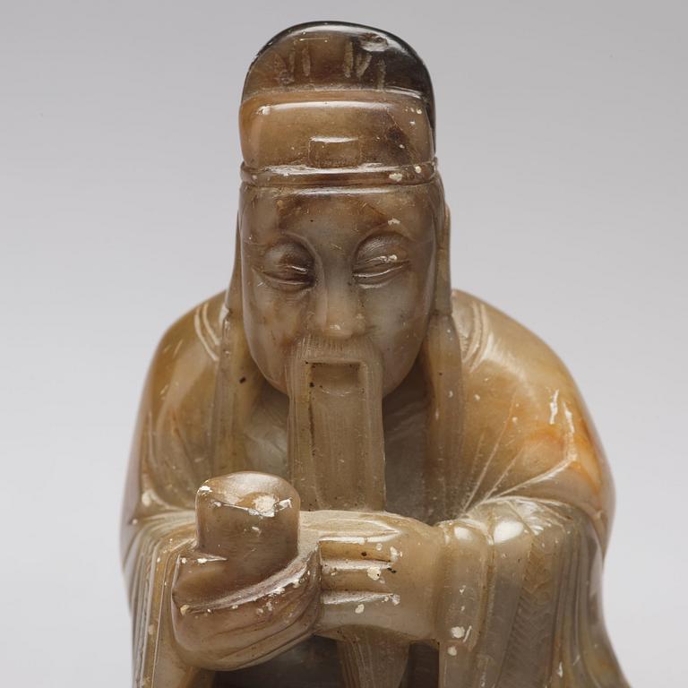 A stone placque, a soapstone figure and a cup, late Qing dynasty.