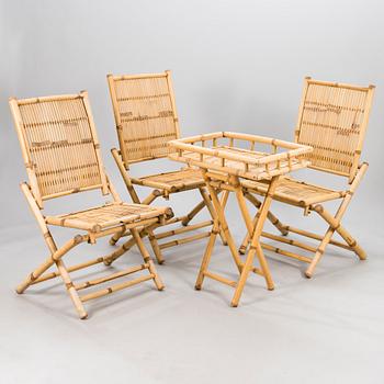 A 20th century four piece garden furniture set.