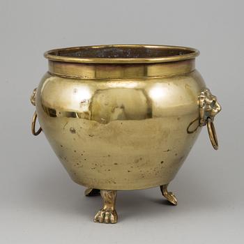 A 19th century brass champagne cooler.