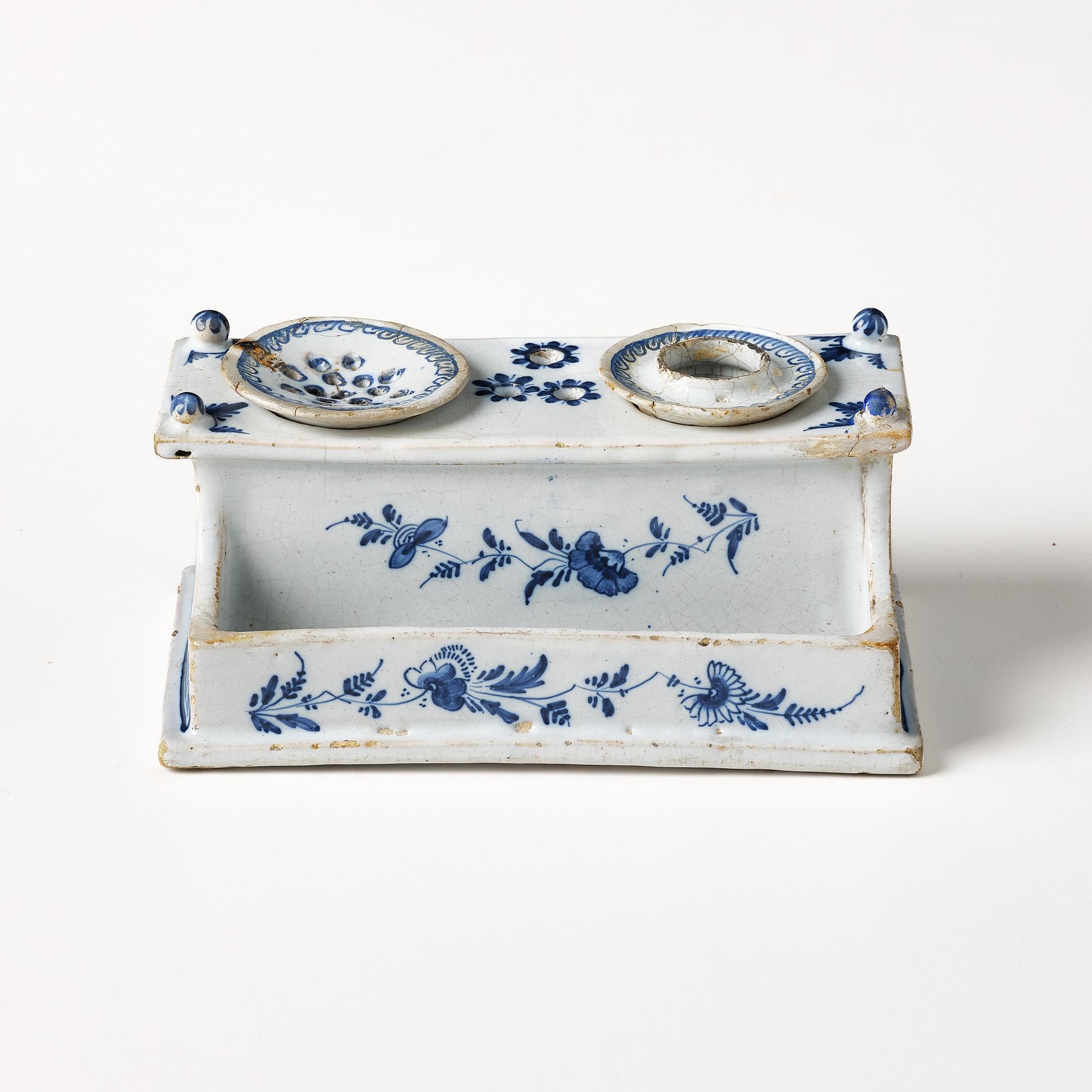 A Swedish Rörstrand faience desk set, dated Stockholm 22/11 1745.