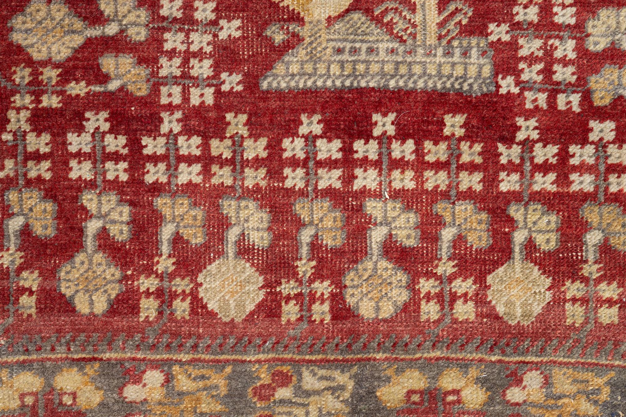 An oriental carpet, c. 195 x 70 cm.
