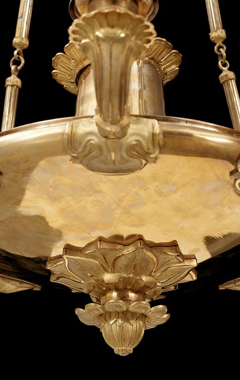 An Empire early 19th century gilt bronze eight-light hanging lamp.