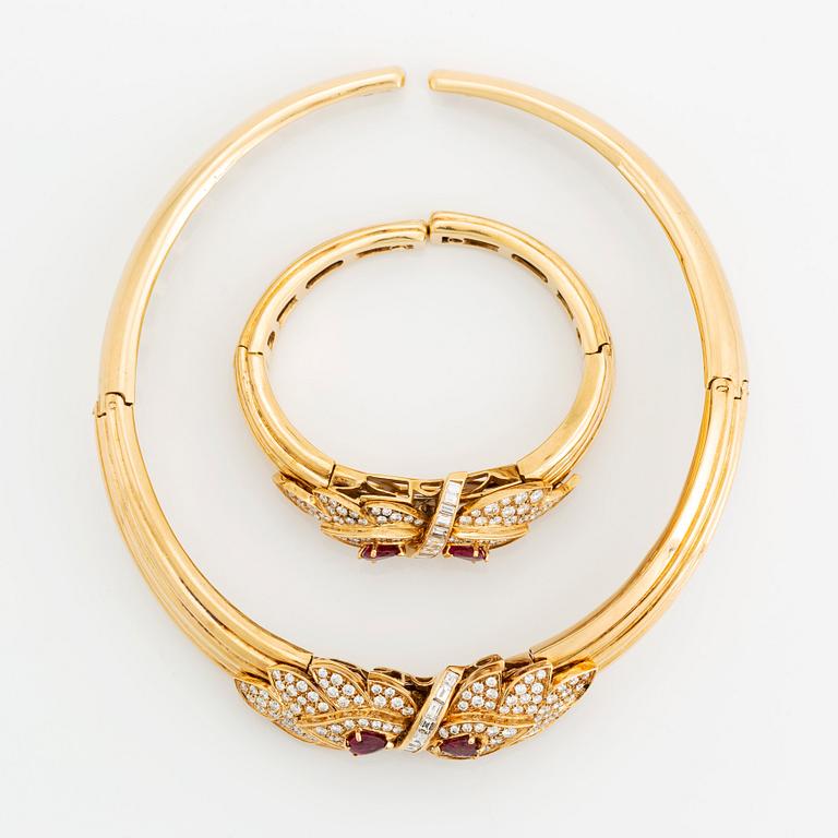 A necklace and a braclet in 18K gold set with faceted rubies.