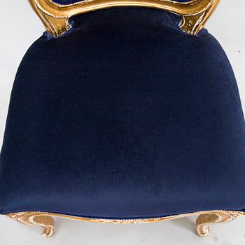 A pair of Rococo style armchairs chairs and chairs, first half of the 20th century.