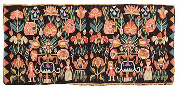 A carrige cushion, "Urnor och par", tapestry weave, ca 102 x 48,5 cm, around the years 1800-1830.