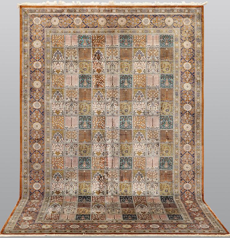 A silk Ghom carpet, 296 x 194 cm.