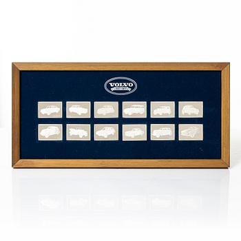 A set of twelve silver plaques, ' De historiska Volvobilarna 1927-1977', Franklin Mint.