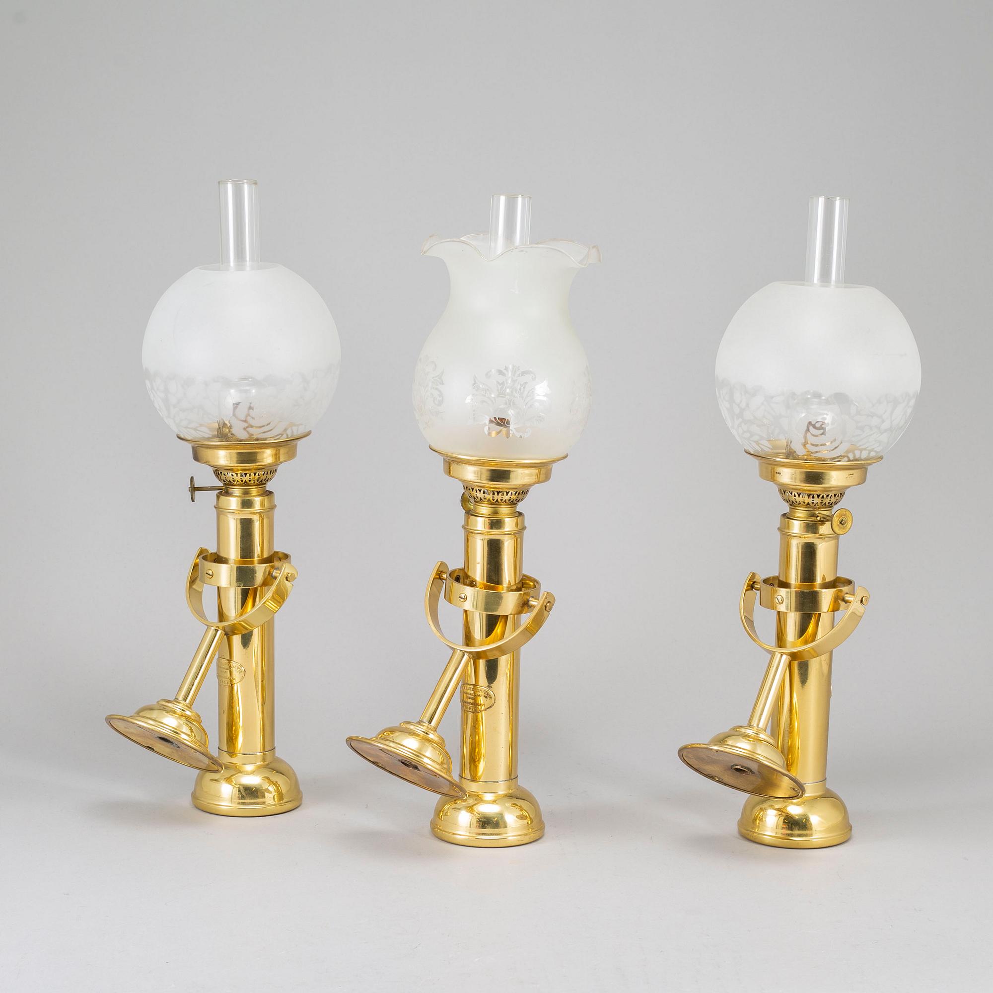 A set of three brass kerosene lamps GV Harnisch Denmark later part of the 20th century.