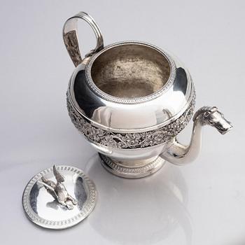A silver pitcher with lid, unidentified maker LH, 19th century.