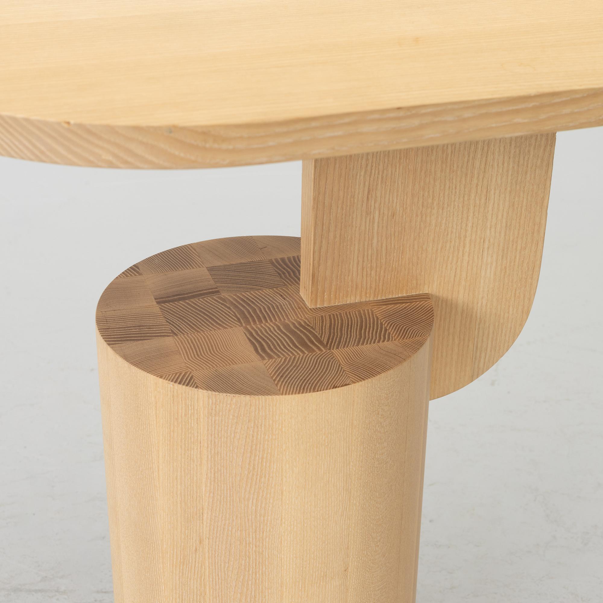 An 'Insert' side table, Firm Living.