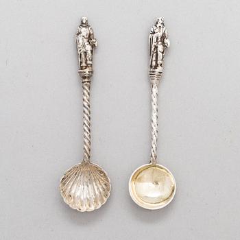 A pair of silver saltcellars, maker's mark of John Edward Wilmot, Birmingham year 1900, and two silver salt spoons.