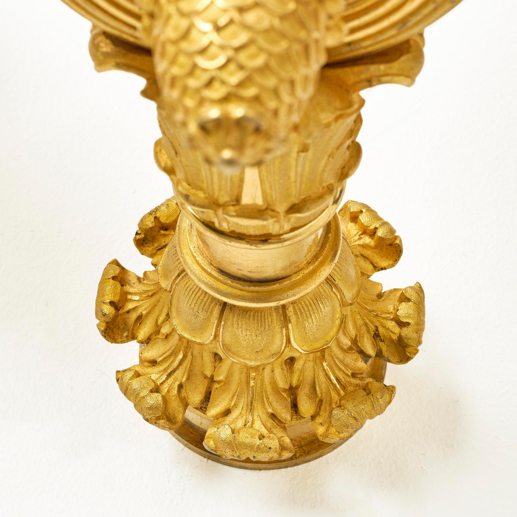 A pair of French Empire six-branch ormolu appliques, ca 1820's.