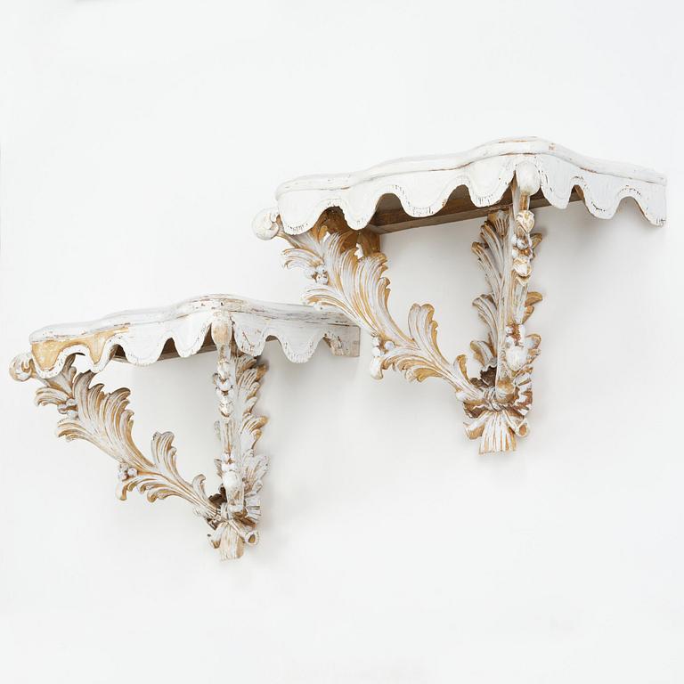A pair of French Louis XVI-style consoles, late 19th century.
