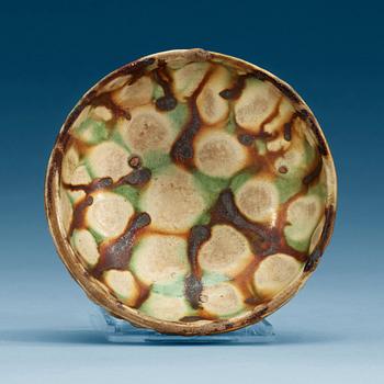 A sancai glazed pottery bowl, Tang dynasty (618-907).