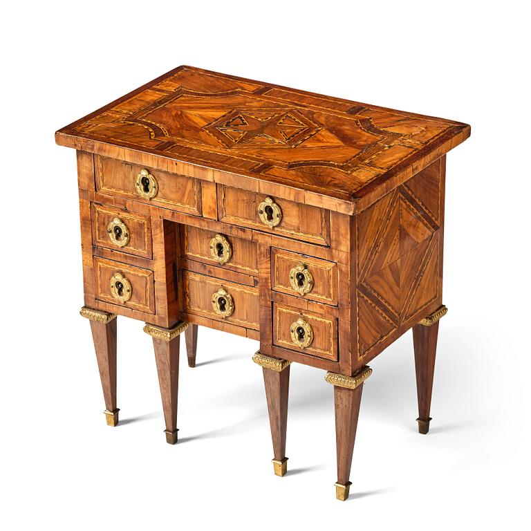 A Louis XVI parquetry miniature commode, late 18th century.
