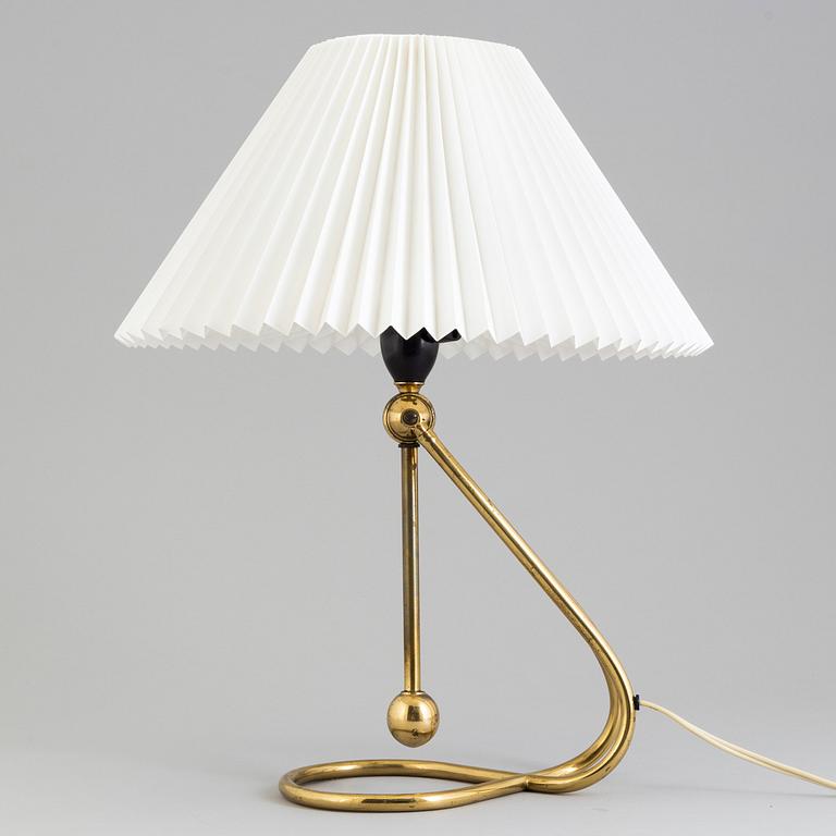 A Le Klint brass table or wall lamp.