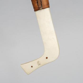 Oskar Tjäder, A reindeer horn knife, signed.