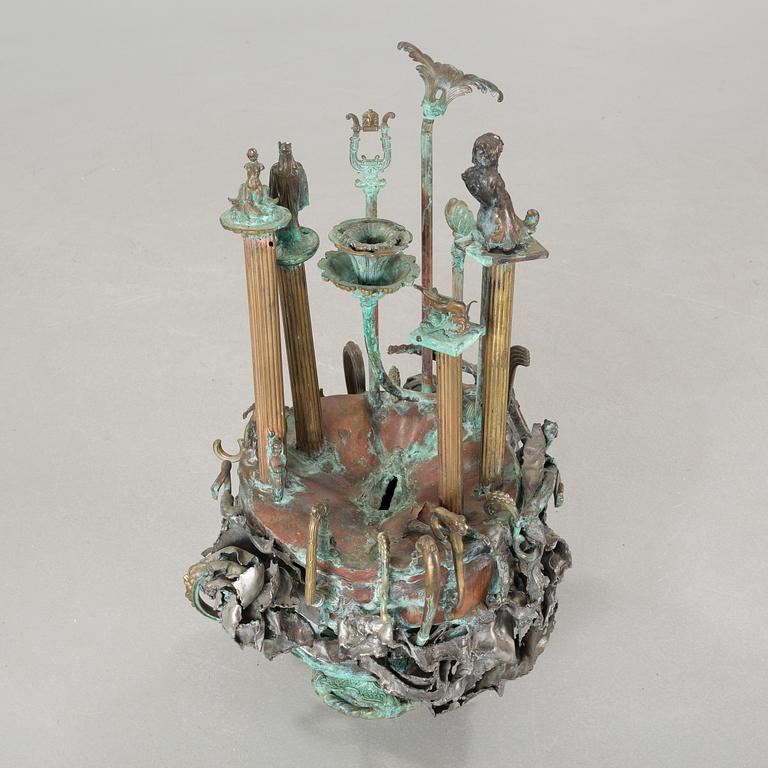 a metal sculpture, signed and dated 1980.