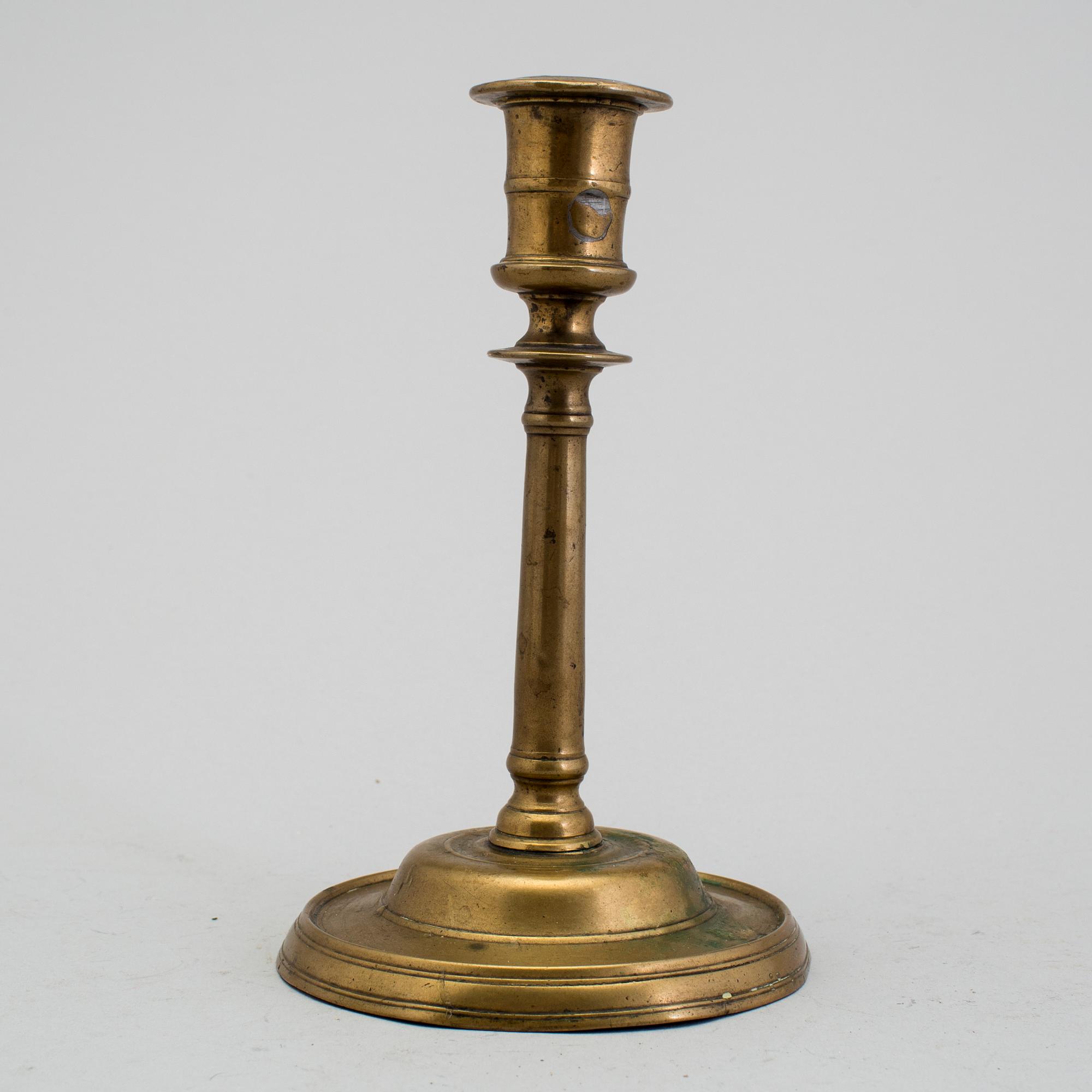 A 1500s bronze candlestick.