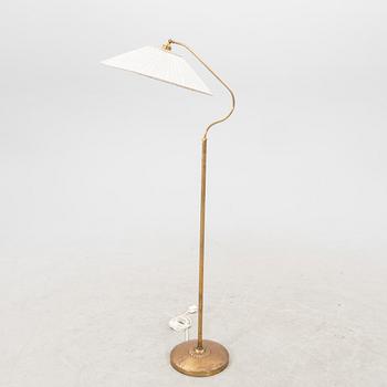 A 1940s brass  floor lamp.