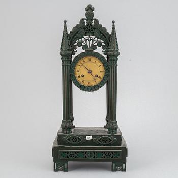 A cast iron gothic revival mantel clock, late 19th century.
