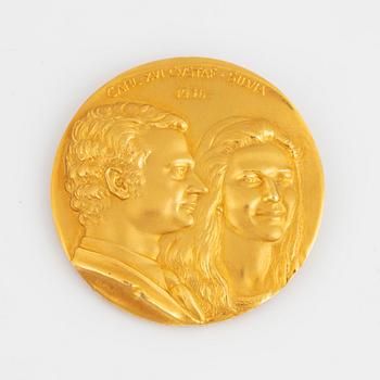 A Swedish commemorative medal in 18K gold.