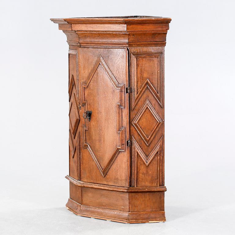 A 18th century corner cabinet.