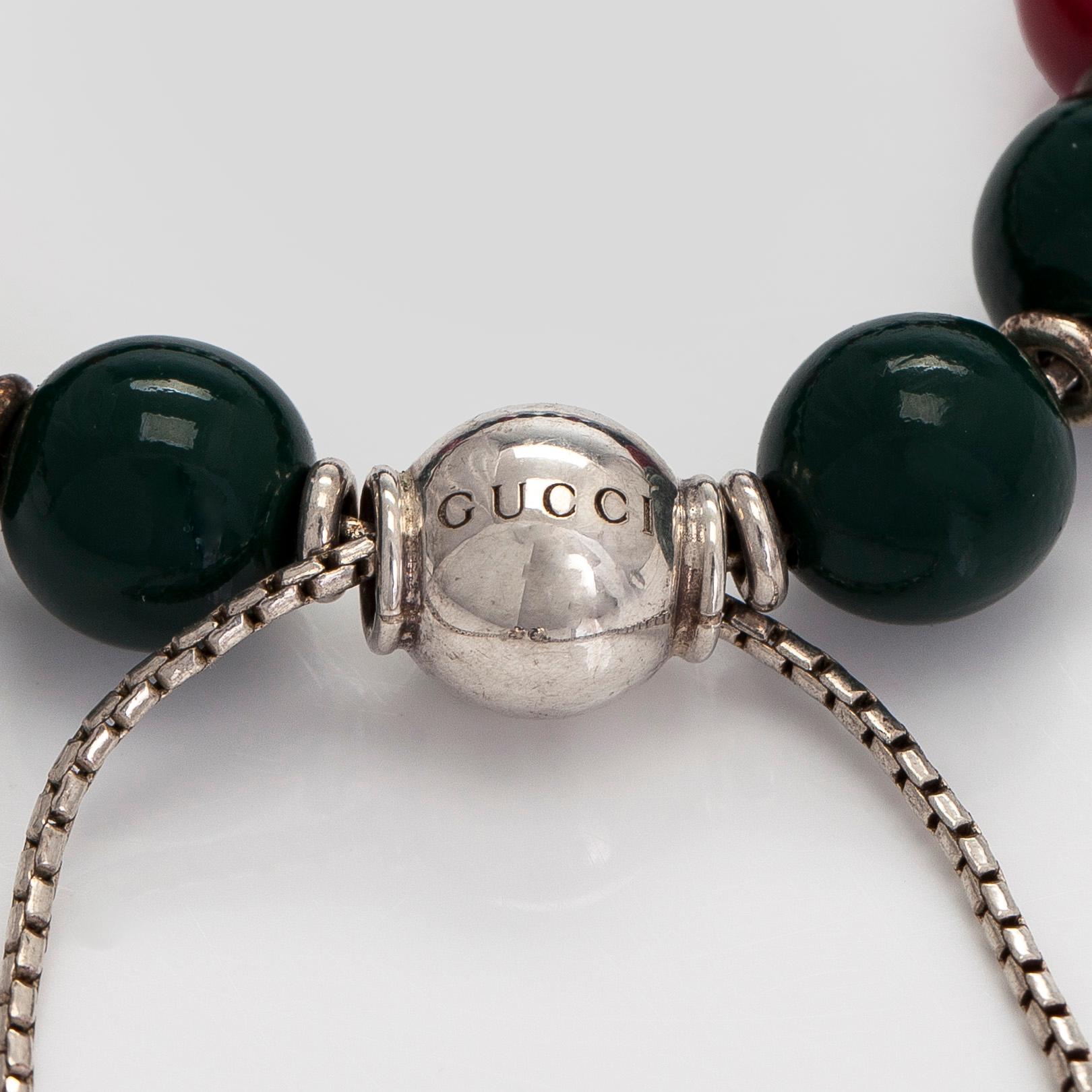 Gucci, a 'Boule Britt"' bracelet.