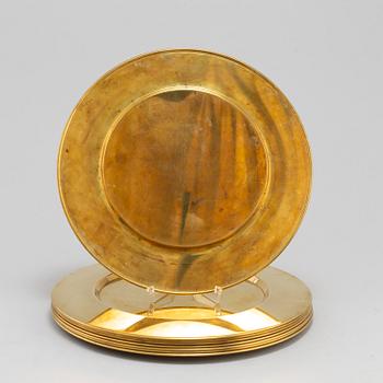 Eight brass plates by Stelton, Denmark, second half of the 20th century.
