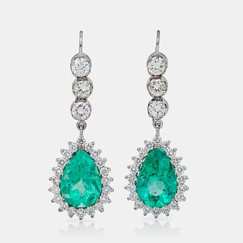 681. A pair of emerald and brilliant-cut diamond earrings.