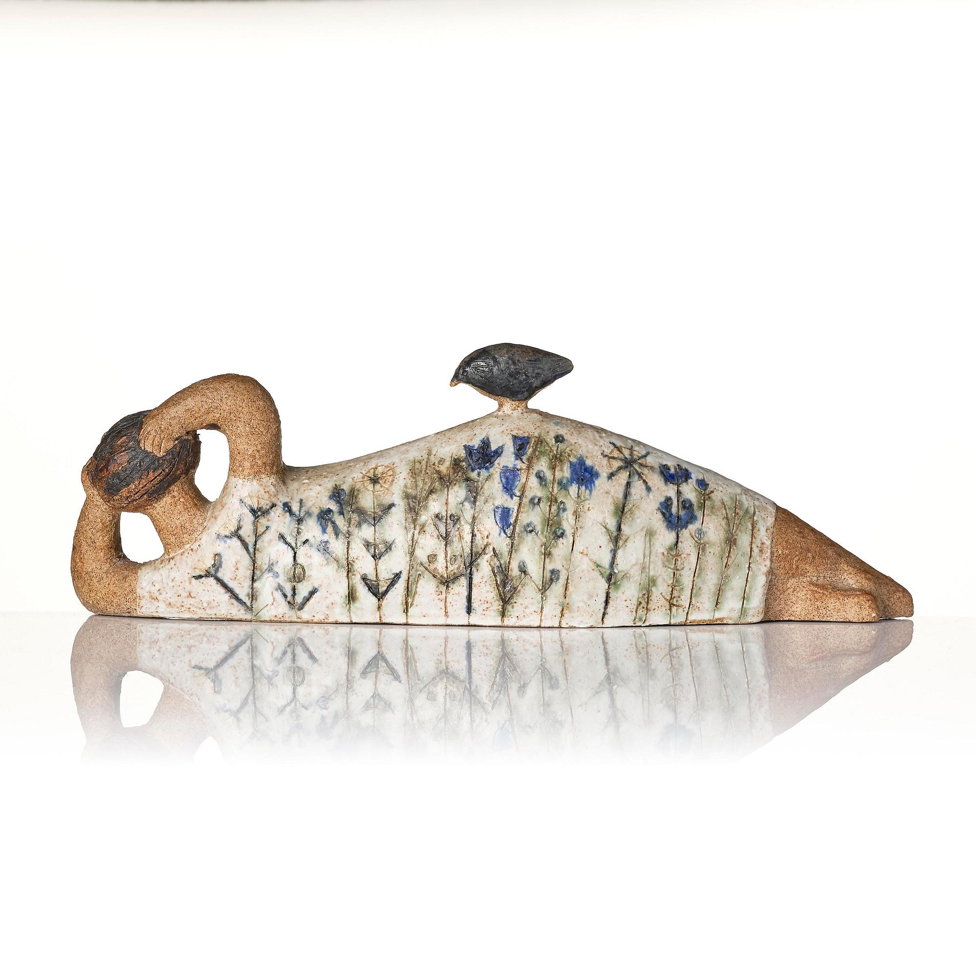 Lisa Larson, a unique chamotte stoneware sculpture of a reclining female figure with a bird, Gustavsberg Studio, probably 1950s-60s.