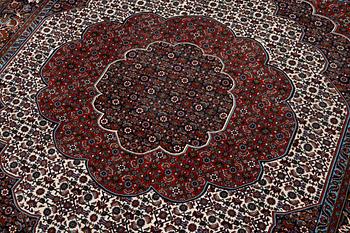 An Oriental rug, approx. 213 x 201 cm.