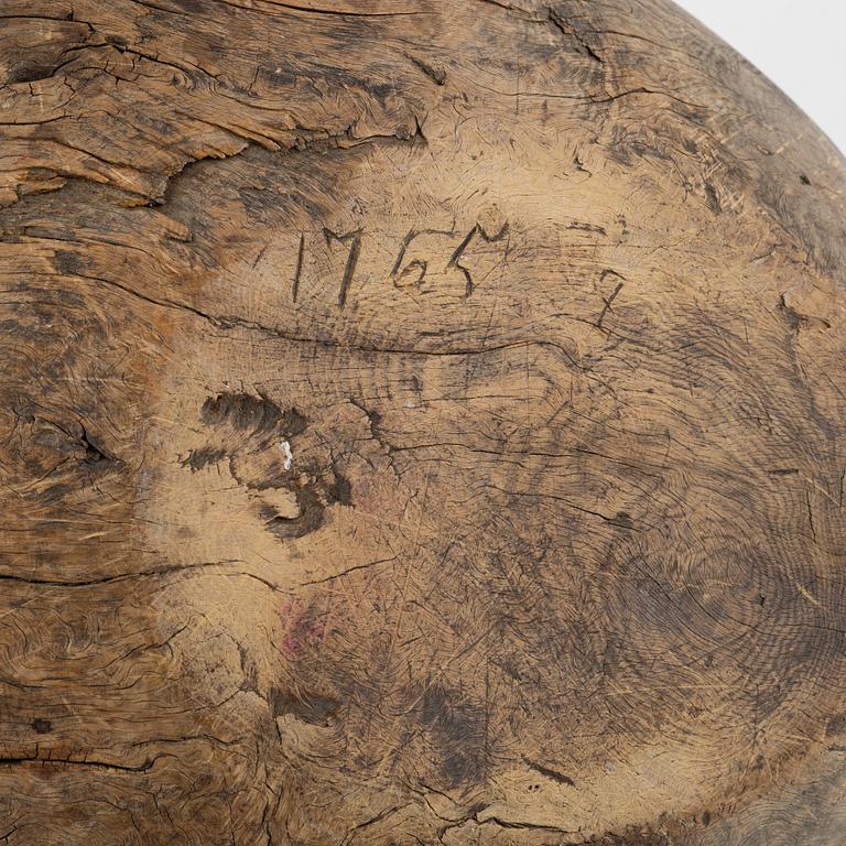 A wood bowl, dated 1765.