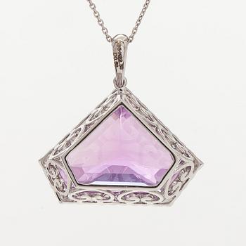 A 14K gold necklace with kunzite and brilliant cut diamonds.