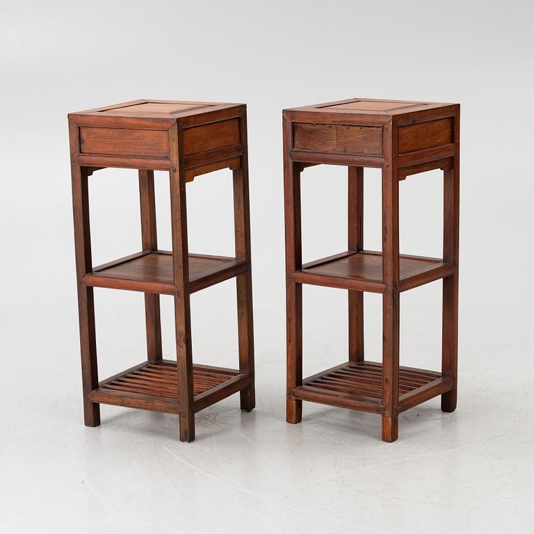 A pair of Chinese lamp tables / pedestals, hardwood, 20th century.